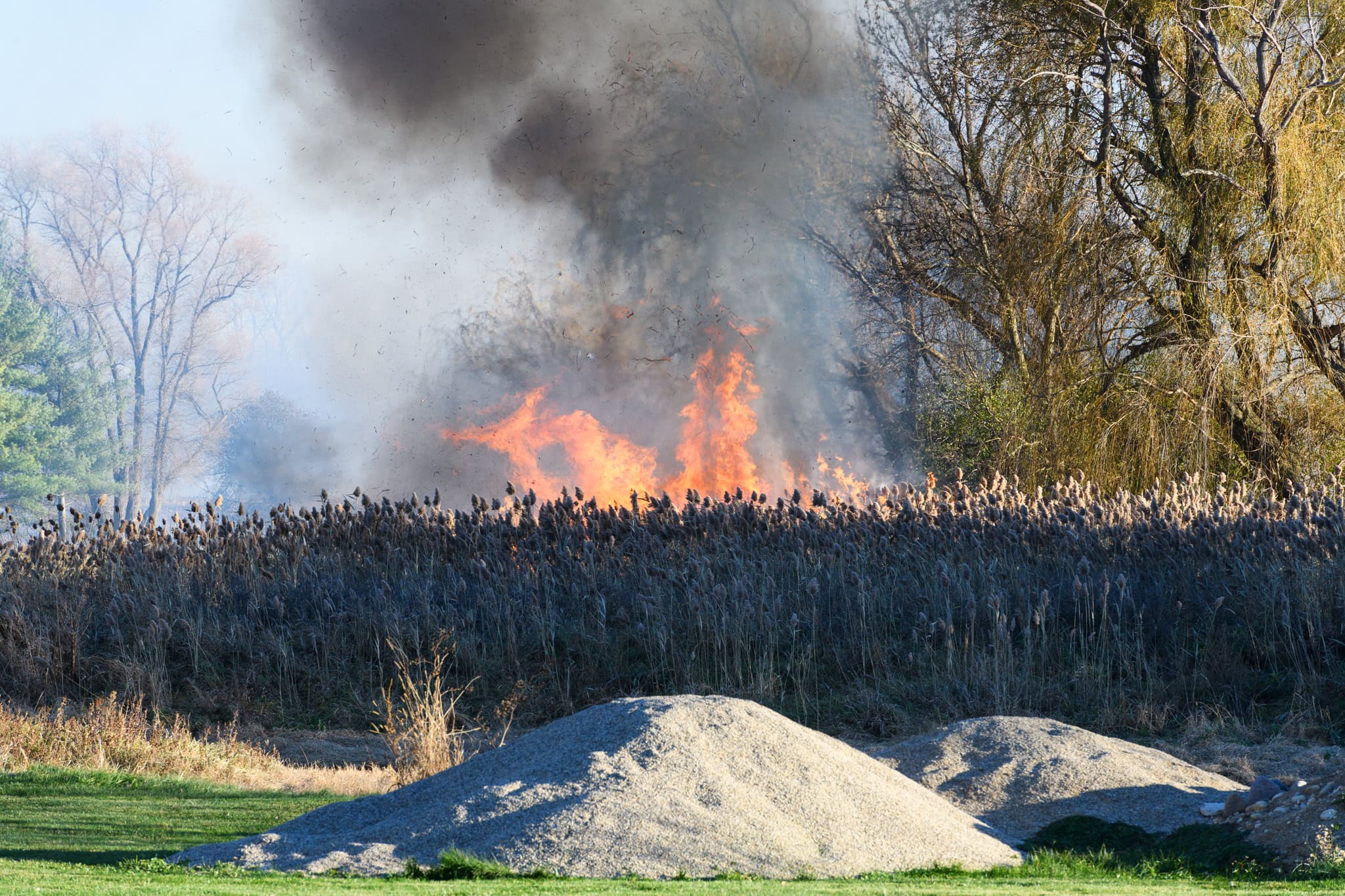 Over dozen fire departments respond after brush fire burns